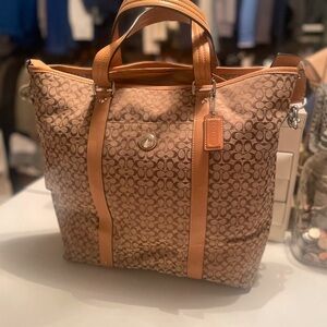Authentic Coach satchel with additional strap.
